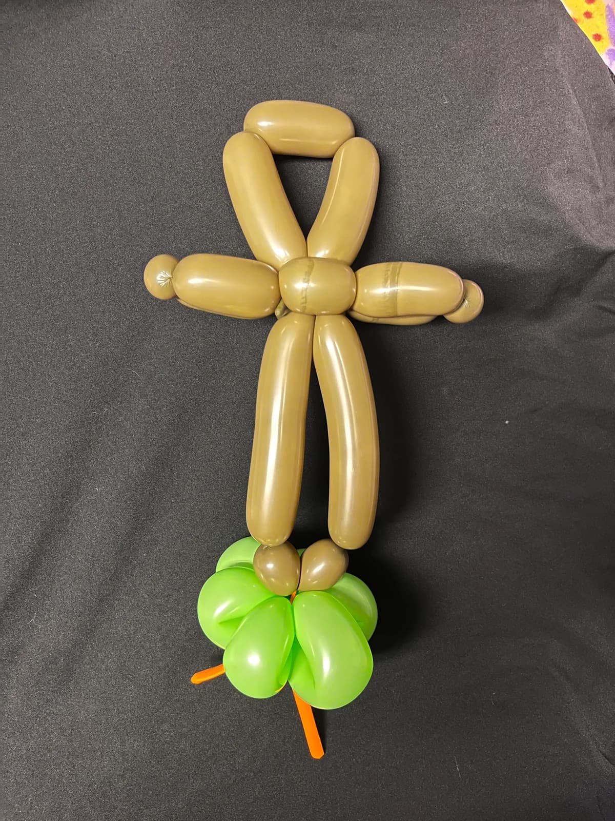 Gold balloon bunny on a green base